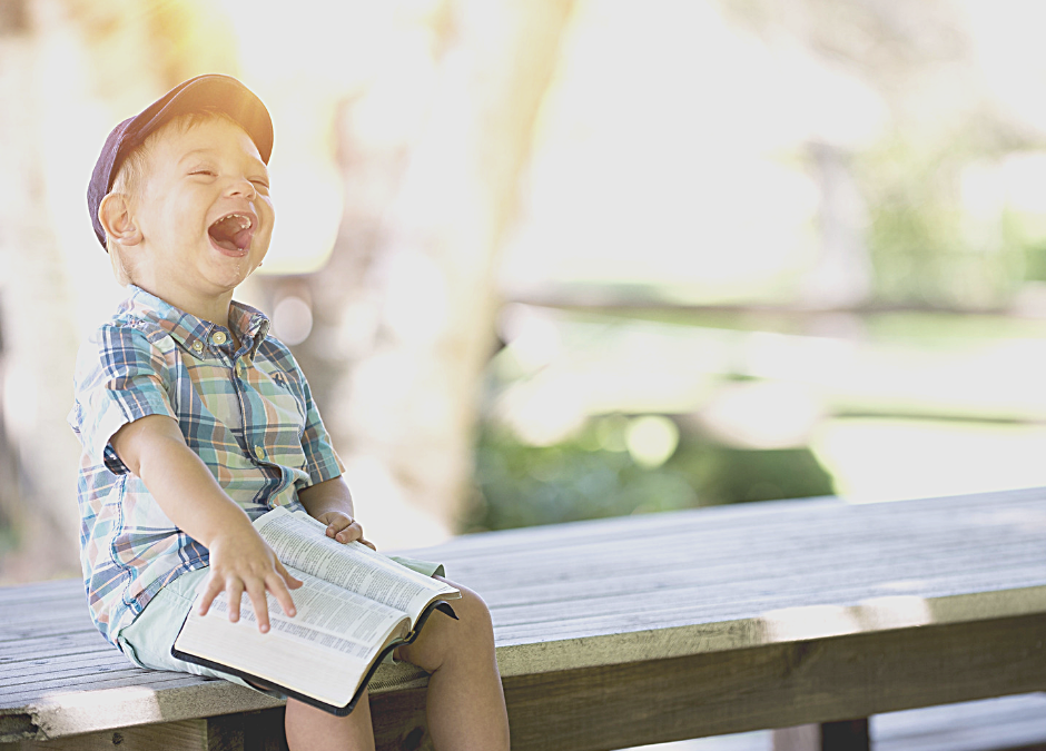 child-laughing-and-reading